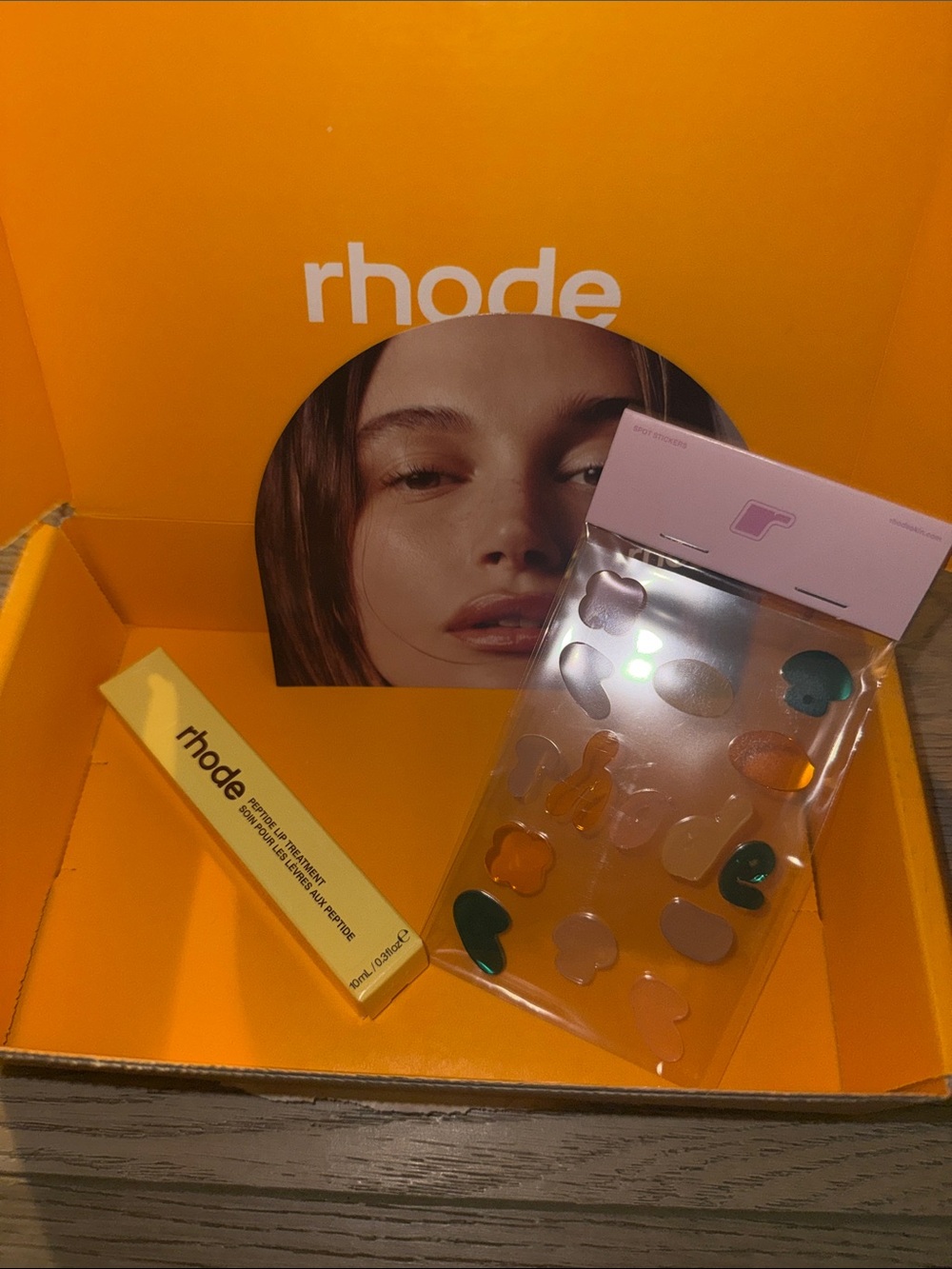 Rhode caramelized banana peptide lip treatment and window stickers